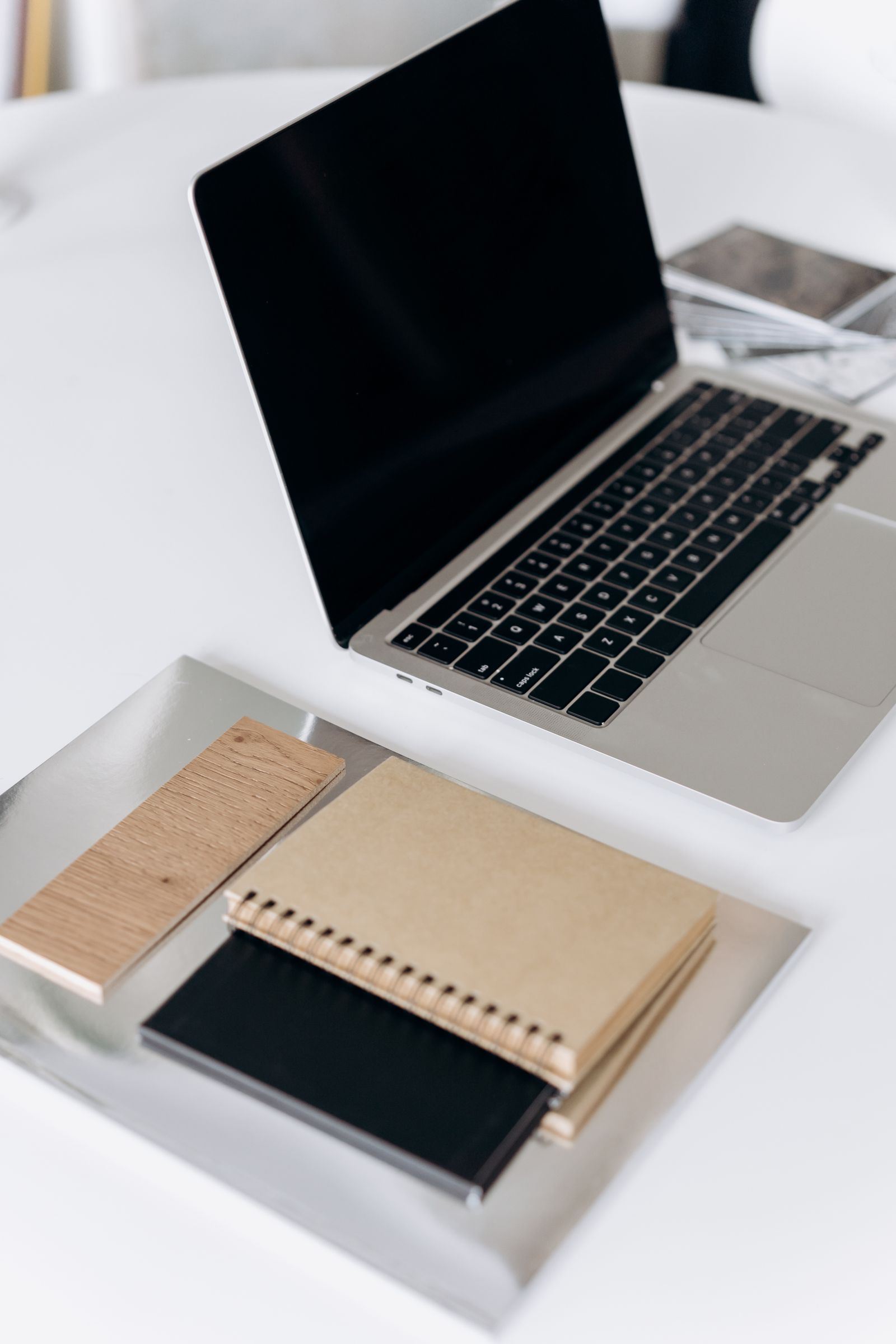 Laptop and notebook on a desk